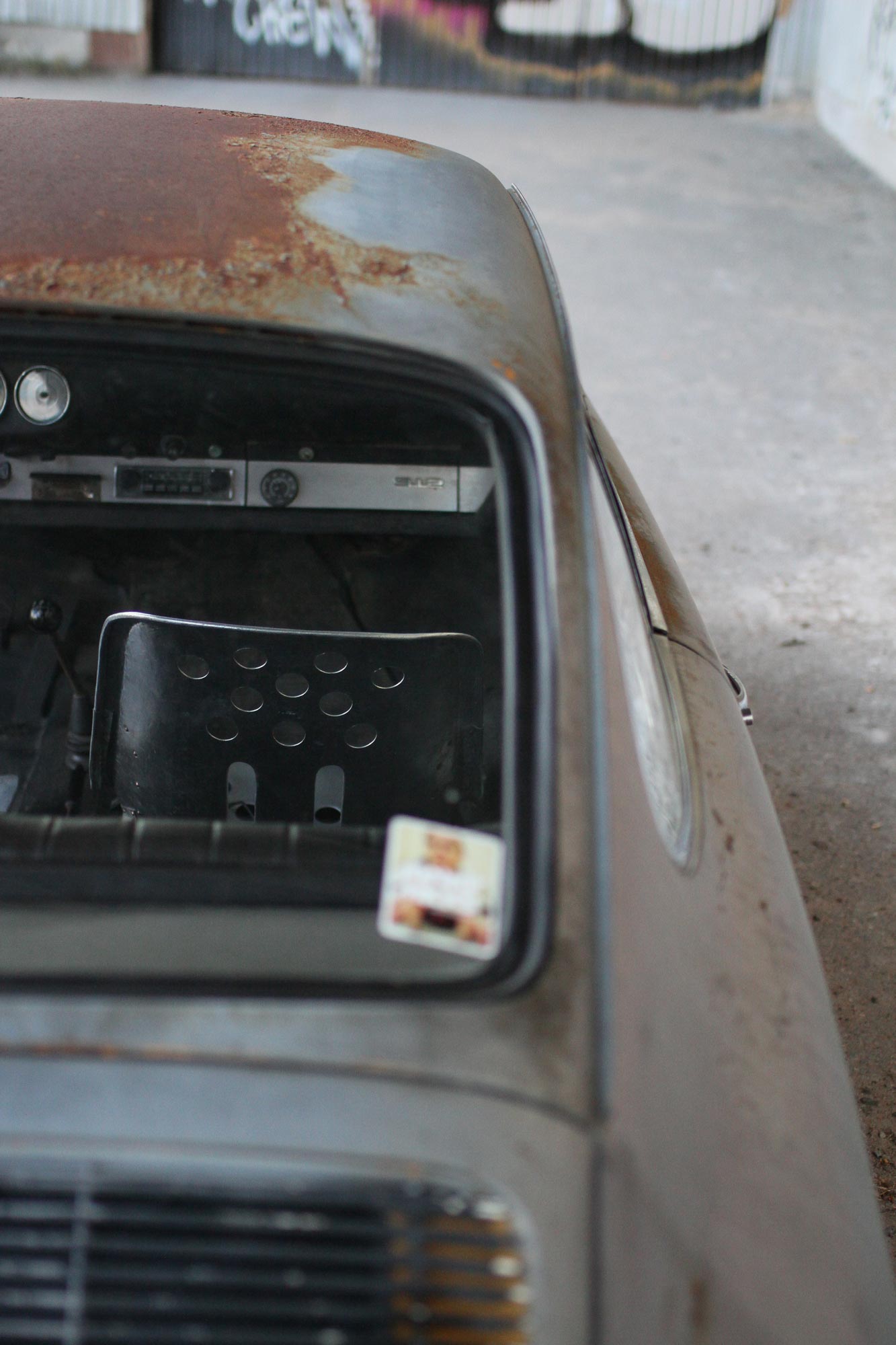 Porsche 912 with a stainless steel chair from Urbans Garage with a rusty roof